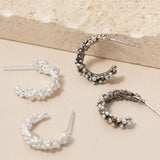 Oxidised and bright sterling silver hoop earrings in molten bubble design by Rockpool Jewellery, handcrafted in Whitley Bay