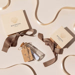 Eco-friendly jewellery gift packaging from Rockpool Jewellery with cream boxes, grosgrain ribbon, and coastal-inspired thank-you message