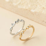 Gold and silver ocean wave rings with sparkling diamond accents, handcrafted by Rockpool Jewellery in an organic, flowing coastal-inspired design