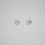 Organic molten silver stud earrings with a textured, modern finish