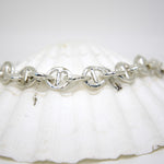 Handmade sterling silver mariners link chain bracelet inspired by coastal textures and rippling water, chunky small link bracelet from Sandbank Collection by Rockpool Jewellery